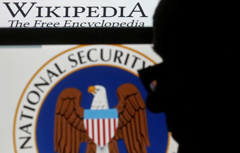 &copy; Reuters. FILE PHOTO: A man is silhouetted near logos of the U.S. National Security Agency (NSA) and Wikipedia in this photo illustration taken in Sarajevo March 11, 2015. REUTERS/Dado Ruvic