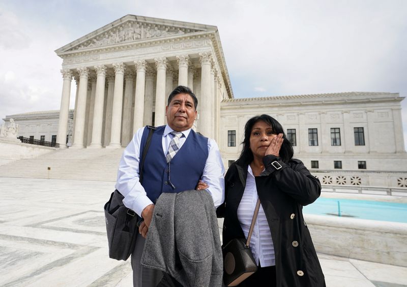 © Reuters. Beatriz Gonzalez and Jose Hernandez, the mother and stepfather of Nohemi Gonzalez who was fatally shot in the 2015 Paris attacks, stand outside the U.S. Supreme Court after justices heard arguments in Gonzalez v. Google in Washington, U.S., February 21, 2023 REUTERS/Kevin Lamarque