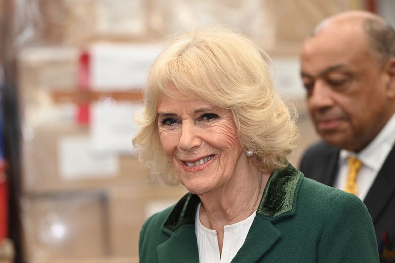&copy; Reuters. FILE PHOTO-Britain's Camilla, Queen Consort, reacts during her visit to Book Aid International in London, Britain February 2, 2023. Eddie Mulholland/Pool via REUTERS