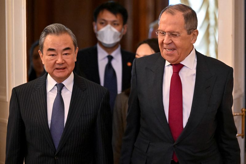 &copy; Reuters. Russia's Foreign Minister Sergei Lavrov and China's Director of the Office of the Central Foreign Affairs Commission Wang Yi enter a hall during a meeting in Moscow, Russia February 22, 2023. Alexander Nemenov/Pool via REUTERS