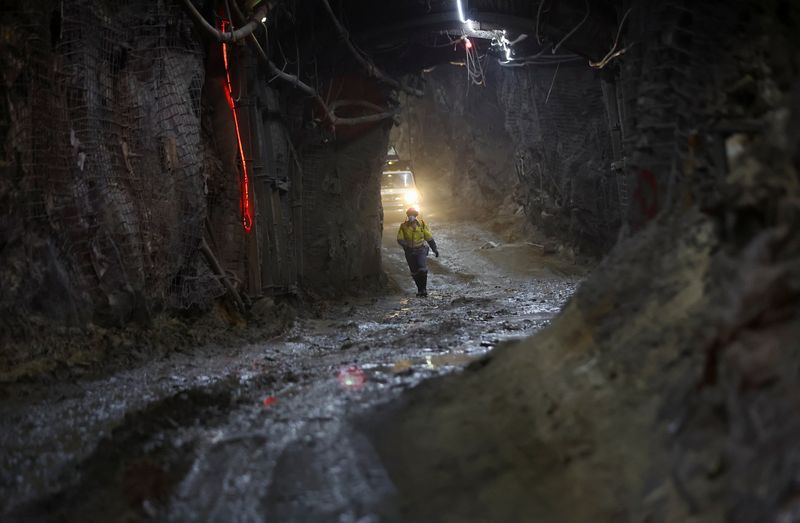 &copy; Reuters. FILE PHOTO: A mine worker walks underground as South Africa's Gold Fields bets on solar to cut costs and carbon, at Gold Fields' South Deep mine, south-west of Johannesburg, South Africa October 12, 2022. REUTERS/Siphiwe Sibeko