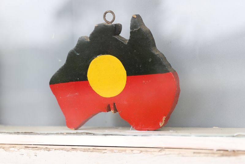&copy; Reuters. FILE PHOTO: A depiction of the Australian Aboriginal Flag is seen on a window sill at the home of indigenous Muruwari elder Rita Wright, a member of the "Stolen Generations", in Sydney, Australia, January 19, 2021. REUTERS/Loren Elliott