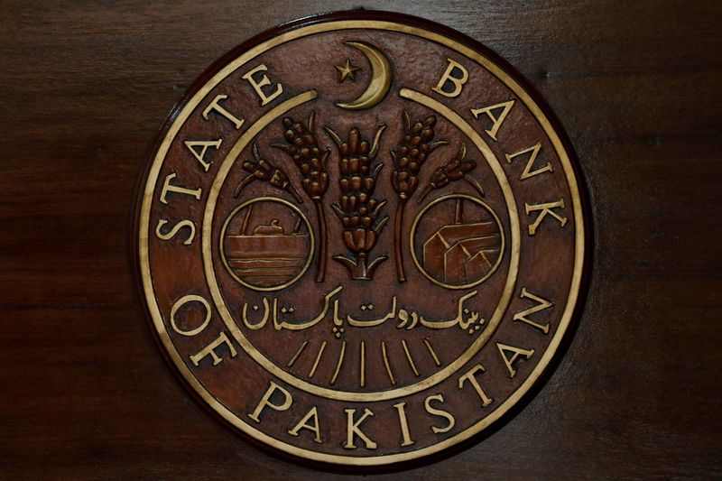&copy; Reuters. FILE PHOTO: The logo of the State Bank of Pakistan (SBP) is pictured on a reception desk at the head office in Karachi, Pakistan July 16, 2019. REUTERS/Akhtar Soomro