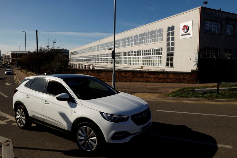 &copy; Reuters. FILE PHOTO: A car is seen in front of the Vauxhall Manufacturing plant in Luton, Britain, on  March 16, 2020. REUTERS/John Sibley/File Photo