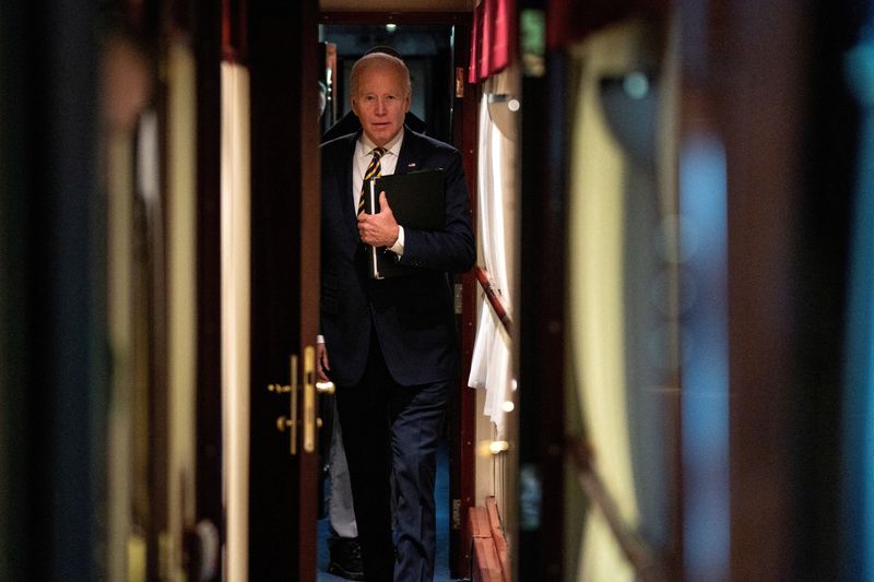 &copy; Reuters. FILE PHOTO: President Joe Biden walks down a corridor to his cabin on a train after a surprise visit with Ukrainian President Volodymyr Zelenskiy, Monday, Feb. 20, 2023, in Kyiv. Biden took a nearly 10-hour train ride from Poland into Kyiv. Evan Vucci/Poo