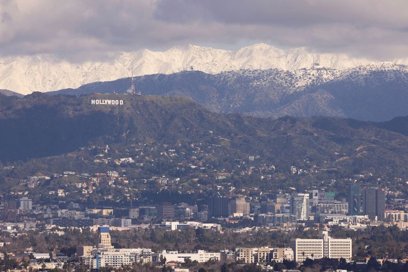 &copy; Reuters. Following a cold winter storm snow is shown on the San Gabriel Mountains behind the city of Los Angeles, California  from Kenneth Hahn Park in Los Angeles, California, February 26, 2023.      REUTERS/Mike Blake