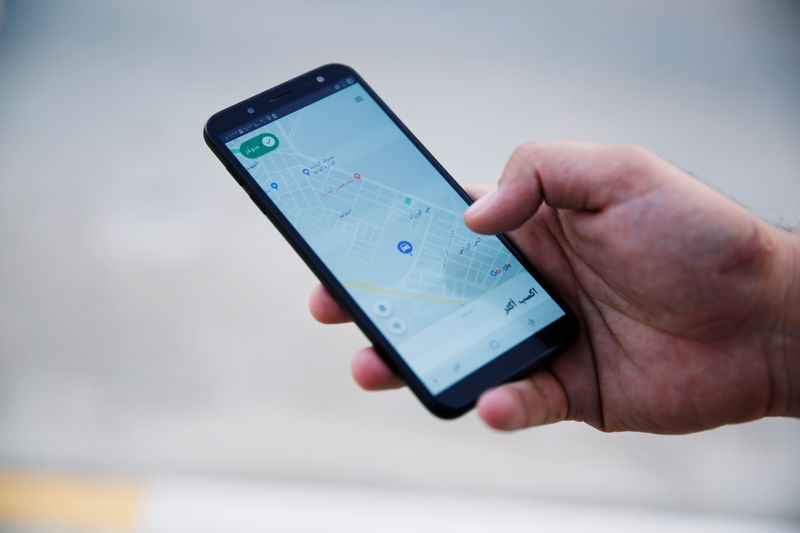 &copy; Reuters. FILE PHOTO: A customer uses Careem application with his smartphone in Mosul, Iraq September 25, 2019. REUTERS/Abdullah Rashid