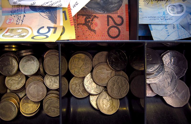 &copy; Reuters. FILE PHOTO: Australian dollar notes and coins can be seen in a cash register at a store in Sydney, Australia, February 11, 2016. REUTERS/David Gray