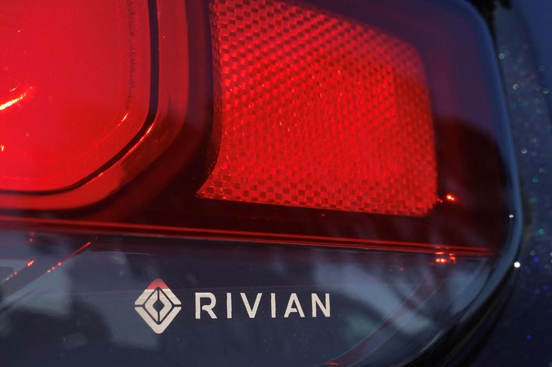 © Reuters. FILE PHOTO: The Rivian name and logo are shown on one of their new electric SUV vehicles in San Diego, U.S., December 16, 2022. REUTERS/Mike Blake