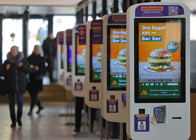 &copy; Reuters. A view shows self-service kiosks advertising the Big Hit burger, the new alternative to the Big Mac, at a restaurant of the Vkusno & tochka fast food chain, the Russian successor brand to McDonald's, in Moscow, Russia March 1, 2023. REUTERS/Evgenia Novozh
