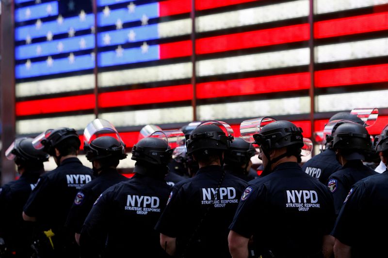 &copy; Reuters. FILE PHOTO: New York Police Department (NYPD) officers are pictured as protesters rally against the death in Minneapolis police custody of George Floyd, in Times Square in the Manhattan borough of New York City, U.S., June 1, 2020. REUTERS/Mike Segar