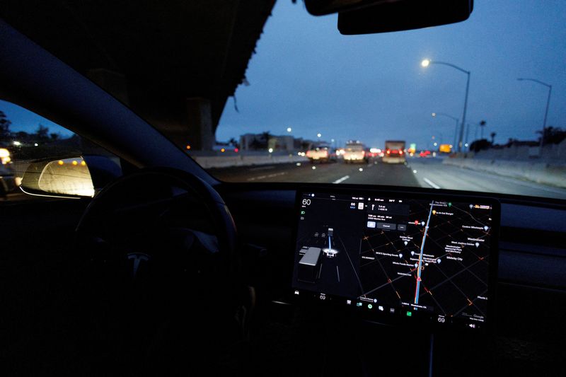 &copy; Reuters. FILE PHOTO:  A Tesla Model 3 vehicle drives on autopilot along the 405 highway in Westminster, California, U.S., March 16, 2022. REUTERS/Mike Blake