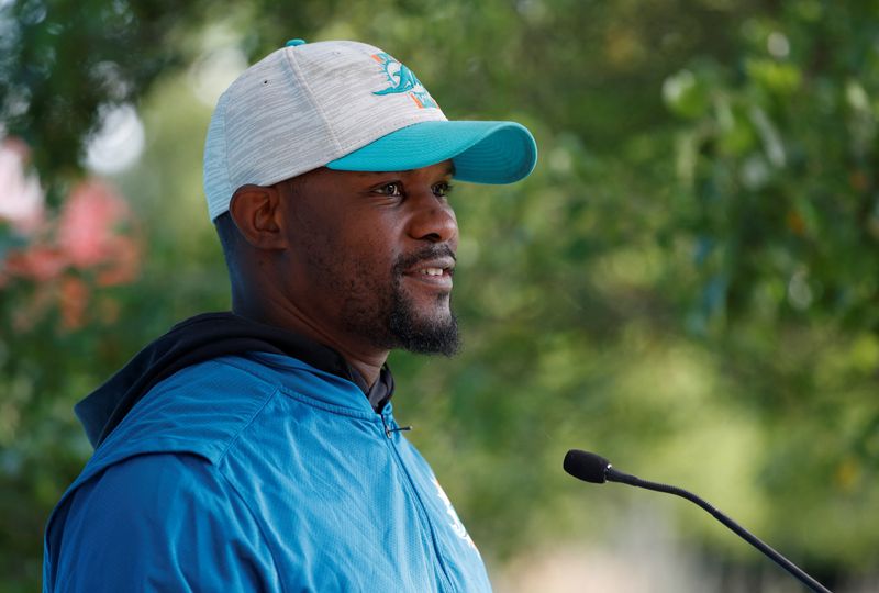 &copy; Reuters. FILE PHOTO: American Football - NFL - Miami Dolphins Media Day - Hanbury Manor Marriott Hotel & Country Club, Ware, Britain - October 15, 2021 Miami Dolphins' Brian Flores during a press conference REUTERS/Paul Childs