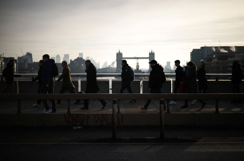 &copy; Reuters. FILE PHOTO: People walk over London Bridge during morning rush hour in London, Britain, February 10, 2023. REUTERS/Henry Nicholls