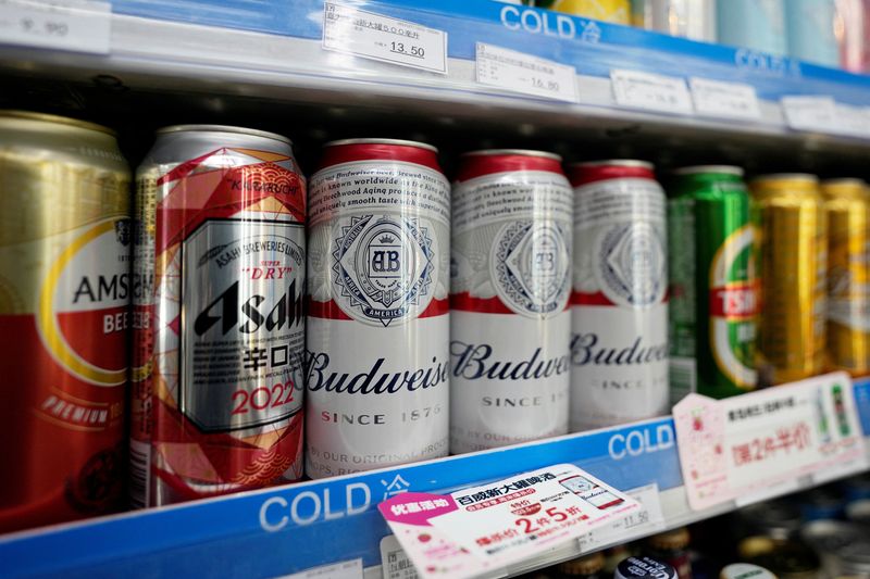&copy; Reuters. FILE PHOTO: Cans of Budweiser beer are displayed amid others on a supermarket shelf in Shanghai, China February 24, 2022. REUTERS/Aly Song/File Photo