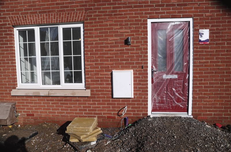 &copy; Reuters. FILE PHOTO: The door of a newly constructed Taylor Wimpey home is protected with plastic on a housing estate in Aylesbury, Britain, February 7, 2017.  REUTERS/Eddie Keogh
