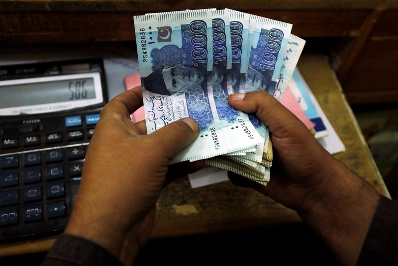 Pakistani rupee touches record low, bonds fall as IMF talks drag