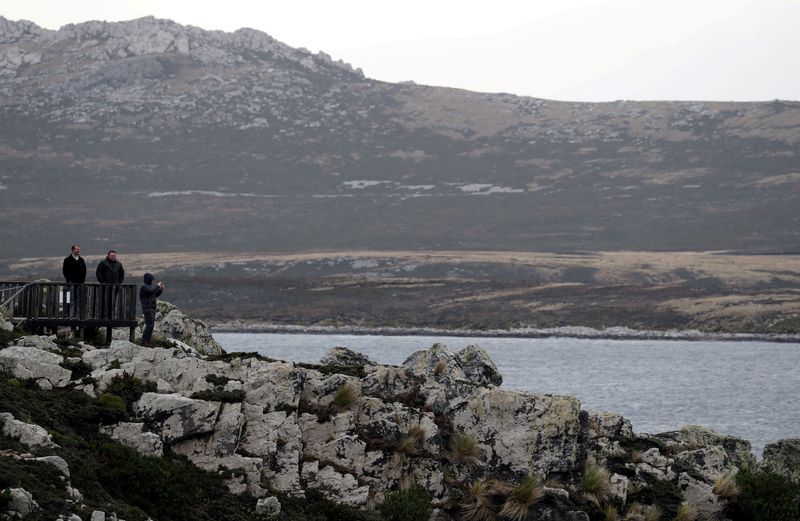 &copy; Reuters. FILE PHOTO: People visit Gypsy Cove, near Port Stanley, Falkland Islands, May 17, 2018. REUTERS/Marcos Brindicci