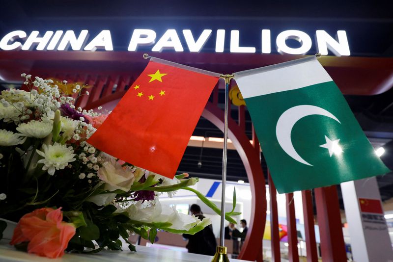 © Reuters. Flags of Pakistan and China are seen at the entrance of the China Pavilion, during the International Defence Exhibition and Seminar 