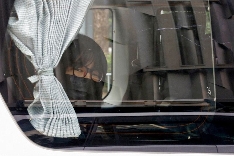 © Reuters. FILE PHOTO: Hong Kong Alliance in Support of Patriotic Democratic Movements of China Vice-Chairwoman Tonyee Chow Hang-tung is seen inside a vehicle after being detained in Hong Kong, China, September 8, 2021. REUTERS/Tyrone Siu