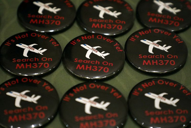 &copy; Reuters. FILE PHOTO: Badges are displayed during the sixth annual remembrance event for the missing Malaysia Airlines flight MH370 in Putrajaya, Malaysia, March 7, 2020. REUTERS/Lim Huey Teng/File Photo