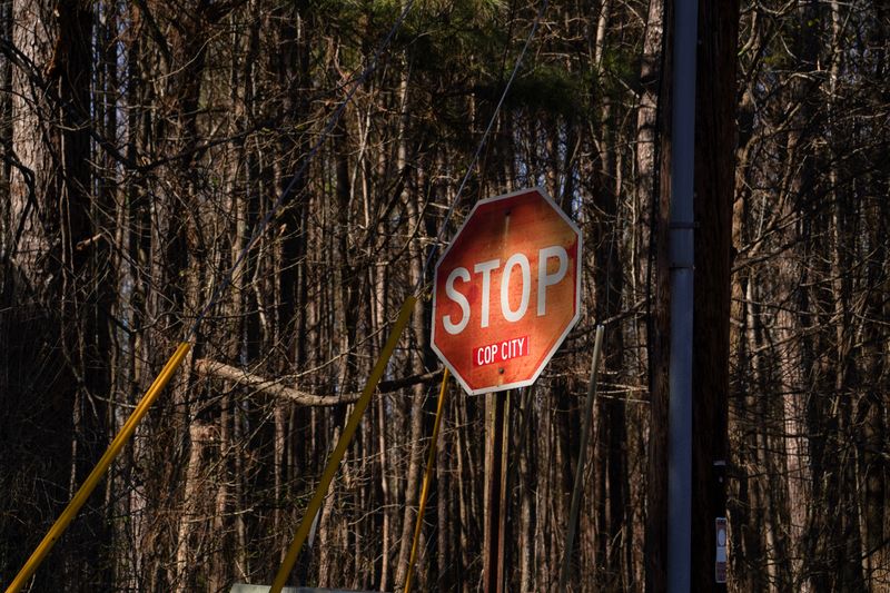 © Reuters. FILE PHOTO: A stop sign sits on the outside of the forest as construction continues after a SWAT escort this morning at the construction site of a public safety training facility that activists have derided with the nickname 