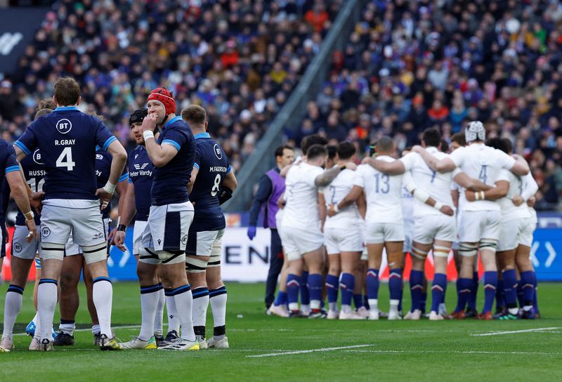 &copy; Reuters. FILE PHOTO: Rugby Union - Six Nations Championship - France v Scotland - Stade de France, Saint-Denis, France - February 26, 2023 Scotland's Grant Gilchrist with team mates as the France players celebrate their first try in a huddle REUTERS/Christian Hart