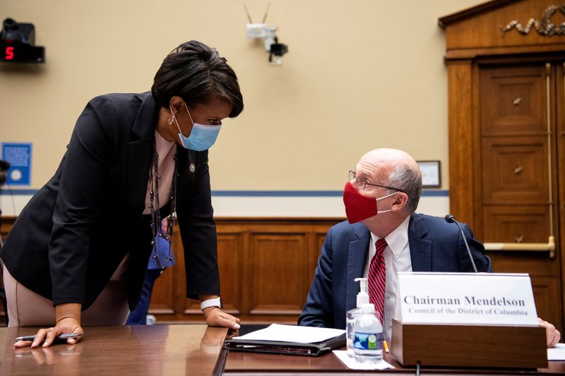 &copy; Reuters. FILE PHOTO: Washington Mayor Muriel Bowser talks with DC Council Chairman Phil Mendelson before the start of the House Oversight and Reform Committee hearing on H.R.51, the "Washington, D.C. Admission Act" in Washington, U.S. March 22, 2021. Caroline Breh