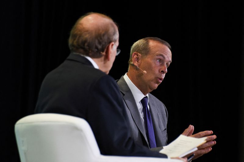 © Reuters. Mike Wirth, the CEO of Chevron Corporation, speaks with Daniel Yergin, the vice chairman of S&P Global, as top energy executives and officials from around the world gather during the CERAWeek 2023 by S&P Global, energy conference in Houston, Texas, U.S., March 6, 2023.  REUTERS/Callaghan O'Hare
