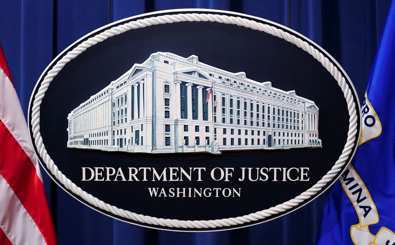 &copy; Reuters. FILE PHOTO: A U.S. Justice Department logo or seal showing Justice Department headquarters, known as "Main Justice," is seen behind the podium in the Department's headquarters briefing room before a news conference with the Attorney General in Washington,