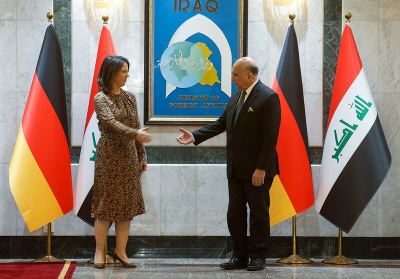 &copy; Reuters. Germany's Foreign Minister Annalena Baerbock and Iraq's Foreign Minister Fuad Hussein shake hands as they meet, in Baghdad, Iraq March 7, 2023. REUTERS/Alaa Al-Marjani