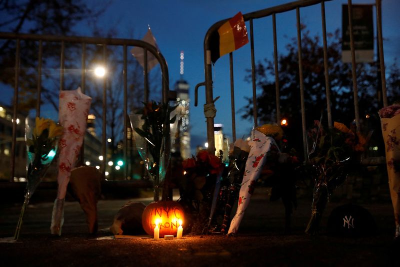 &copy; Reuters. FILE PHOTO: A makeshift memorial for victims of the attack is seen outside a police barricade on the bike path next to West Street, a day after a man driving a rented pickup truck mowed down pedestrians and cyclists on a bike path alongside the Hudson Riv