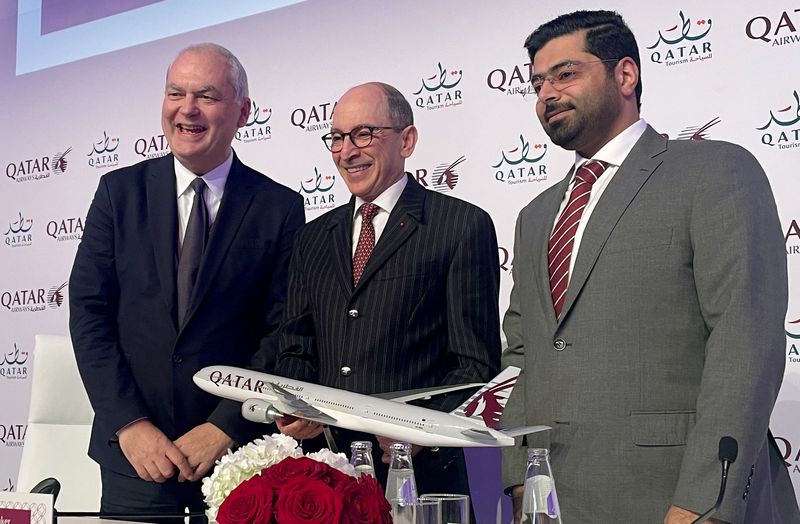 &copy; Reuters. Qatar Airways CCO Thierry Antinori, CEO Akbar Al Baker and Director of Shared Services Omar Al Jaber pose with a model aircraft at the ITB tourism fair in Berlin, Germany, March 7, 2023.     REUTERS/Rachel Moore