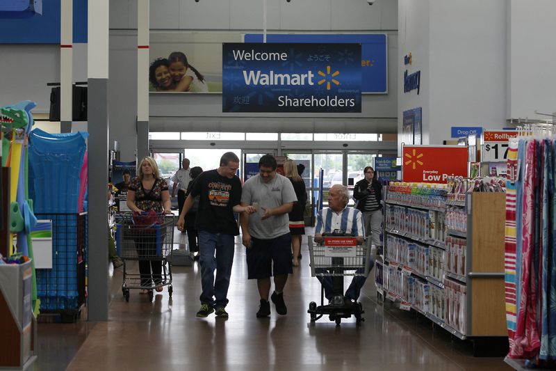 &copy; Reuters. FILE PHOTO: Customers shop at a Walmart Supercenter in Rogers, Arkansas June 6, 2013.     REUTERS/Rick Wilking/File Photo