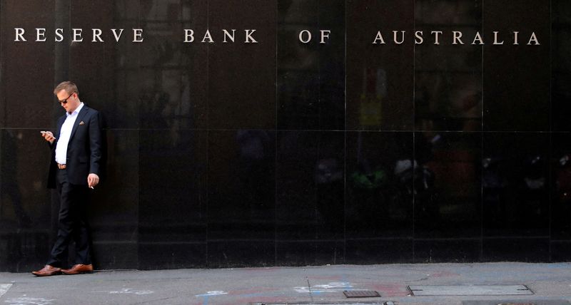 &copy; Reuters. FILE PHOTO: FILE PHOTO: A man smokes next to the Reserve Bank of Australia headquarters in central Sydney, Australia February 6, 2018. REUTERS/Daniel Munoz/File Photo