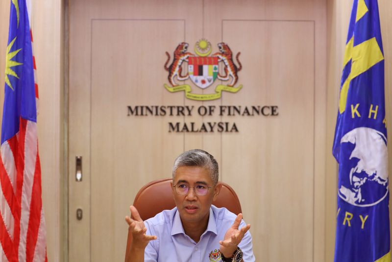 &copy; Reuters. FILE PHOTO: Malaysia's Finance Minister Tengku Zafrul speaks during an interview with Reuters in Putrajaya, Malaysia, April 5, 2021. REUTERS/Lim Huey Teng