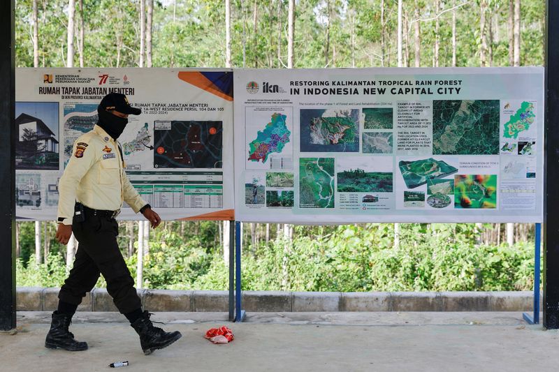 &copy; Reuters. A security guard walks past information boards at the ground zero of Indonesia's new capital, known as Nusantara National Capital (IKN), in Sepaku, East Kalimantan province, Indonesia, March 8, 2023. REUTERS/Willy Kurniawan