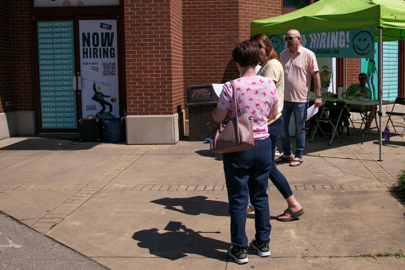 &copy; Reuters. FILE PHOTO: People attend a hiring event for Green District, a new restaurant ahead of its opening, as many restaurant businesses face staffing shortages in Louisville, Kentucky, U.S., June 5, 2021.  REUTERS/Amira Karaoud