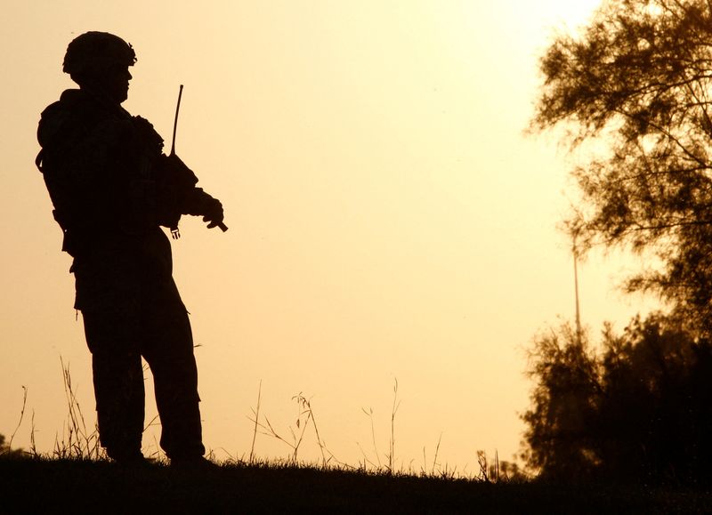 &copy; Reuters. FILE PHOTO: A U.S. soldier stands guard during a peace conference in al-Zawra amusement park in Baghdad November 7, 2008.  REUTERS/Mohammed Ameen