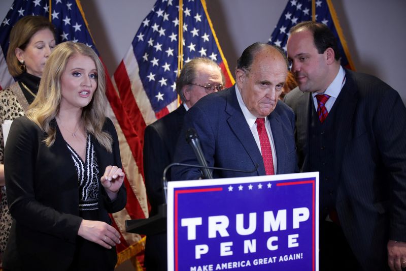 &copy; Reuters. FILE PHOTO: Trump Campaign Senior Legal Advisor Jenna Ellis speaks as Trump campaign advisor Boris Epshteyn whispers to former New York City Mayor Rudy Giuliani, personal attorney to U.S. President Donald Trump, during a news conference about the 2020 U.S