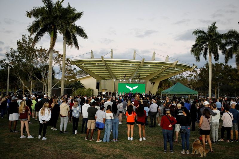 &copy; Reuters. FILE PHOTO: People attend a memorial service on the five-year anniversary since gunman Nikolas Cruz opened fire at Marjory Stoneman Douglas High School killing 14 students and three staff members, in Parkland, Florida, U.S., February 14, 2023. REUTERS/Mar