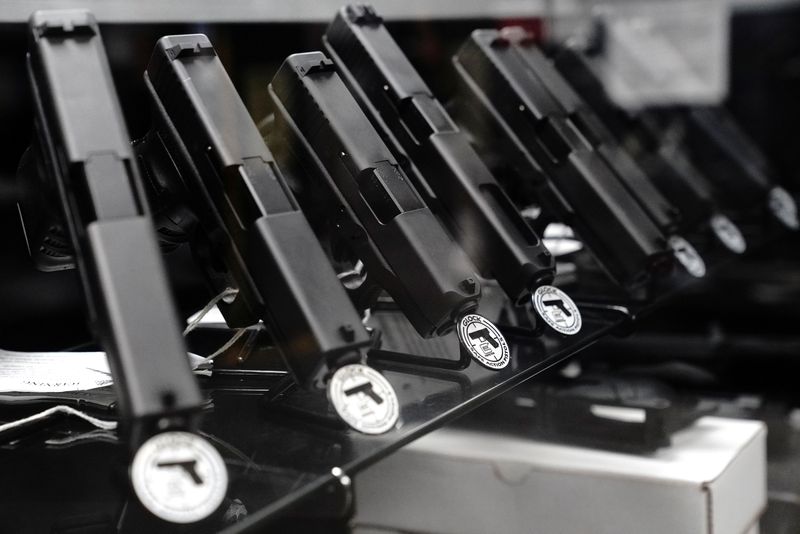 &copy; Reuters. FILE PHOTO: Glock semi-automatic pistols are displayed for sale at Firearms Unknown, a gun store in Oceanside, California, U.S., April 12, 2021.  REUTERS/Bing Guan