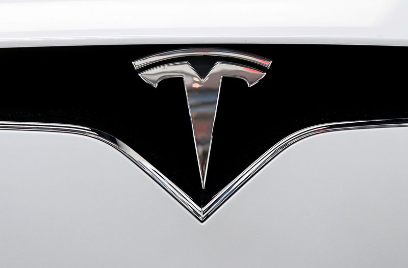 &copy; Reuters. FILE PHOTO: The Tesla logo is seen on a car at Tesla's new showroom in Manhattan's Meatpacking District in New York City, U.S., Dec. 14, 2017. REUTERS/Brendan McDermid/File Photo