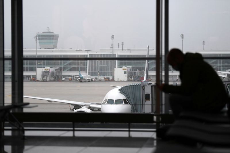 &copy; Reuters. FILE PHOTO: Passenger waits for his flight at Franz-Josef-Strauss airport as the spread of COVID-19 continues in Munich, Germany, November 12, 2020. REUTERS/Andreas Gebert