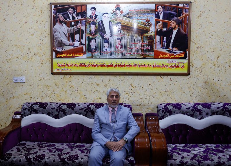 &copy; Reuters. Ali Hassan al-Haidari, who testified against former Iraqi President Saddam Hussein during the Dujail trial, that led to Saddam's death sentence, sits at his home in Dujail, Iraq, January 28, 2023. REUTERS/Ahmed Saad