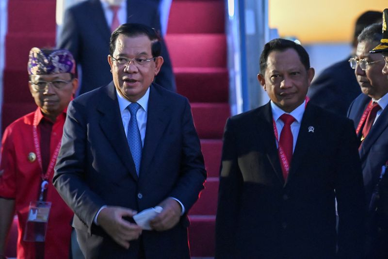 &copy; Reuters. FILE PHOTO-Cambodian Prime Minister Hun Sen walks with Indonesian Home Minister Tito Karnavian and Bali Governor I Wayan Koster upon arrival at Ngurah Rai International Airport ahead of the G20 Summit in Bali, Indonesia November 14, 2022. M Risyal Hidayat