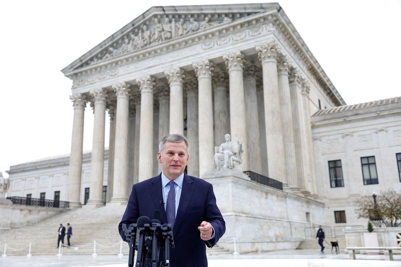 © Reuters. FILE PHOTO: North Carolina Attorney General Josh Stein speaks to the media outside of the United States Supreme Court following oral arguments in Moore v. Harper, a Republican-backed appeal to curb judicial oversight of elections, in Washington, U.S., December 7, 2022. REUTERS/Evelyn Hockstein