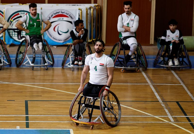 &copy; Reuters. Iraqi former footballer Ahmed Nasser, who lost his leg during a bomb attack in Baghdad in 2007, plays basketball with Iraq's Paralympic team in a training session in Baghdad, Iraq February 1, 2023. REUTERS/Thaier Al-Sudani
