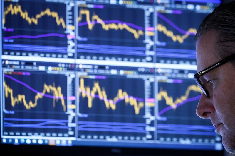 &copy; Reuters. FILE PHOTO: A specialist trader works inside a post on the floor of the New York Stock Exchange (NYSE) in New York City, U.S., March 14, 2023.  REUTERS/Brendan McDermid