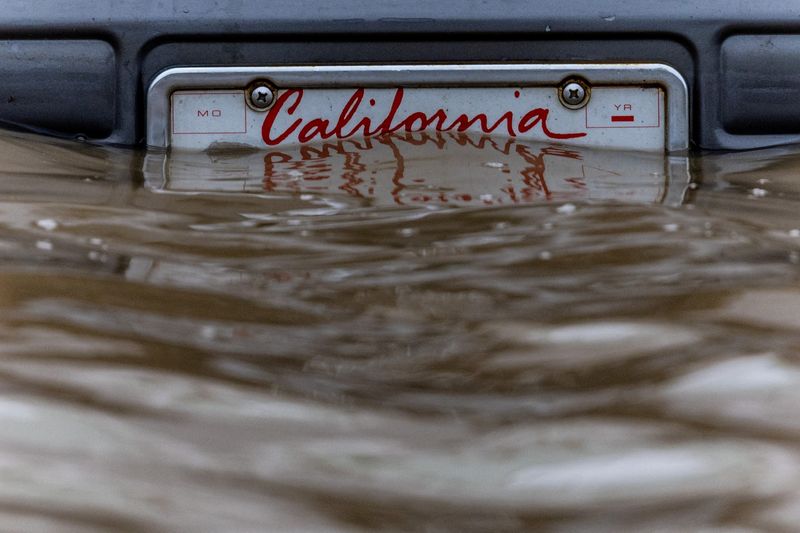 California flooded with rain, Northeast buried under snow